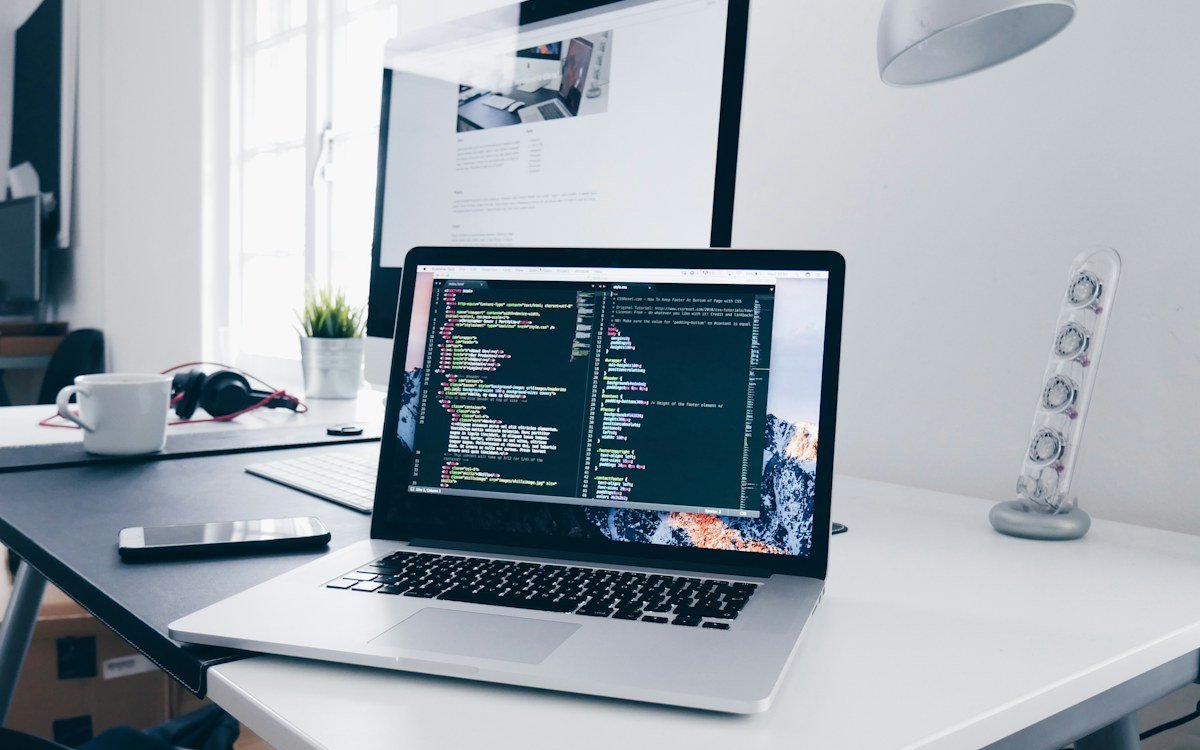Laptop displaying website development code